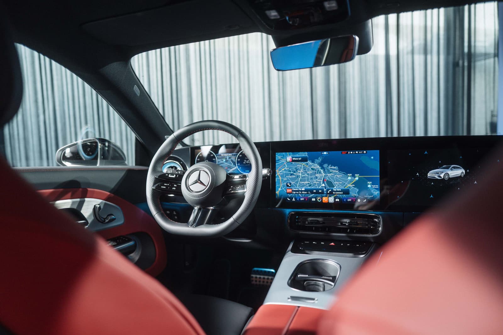 Cockpit of the Mercedes CLA Shooting Brake with its screens and red seats