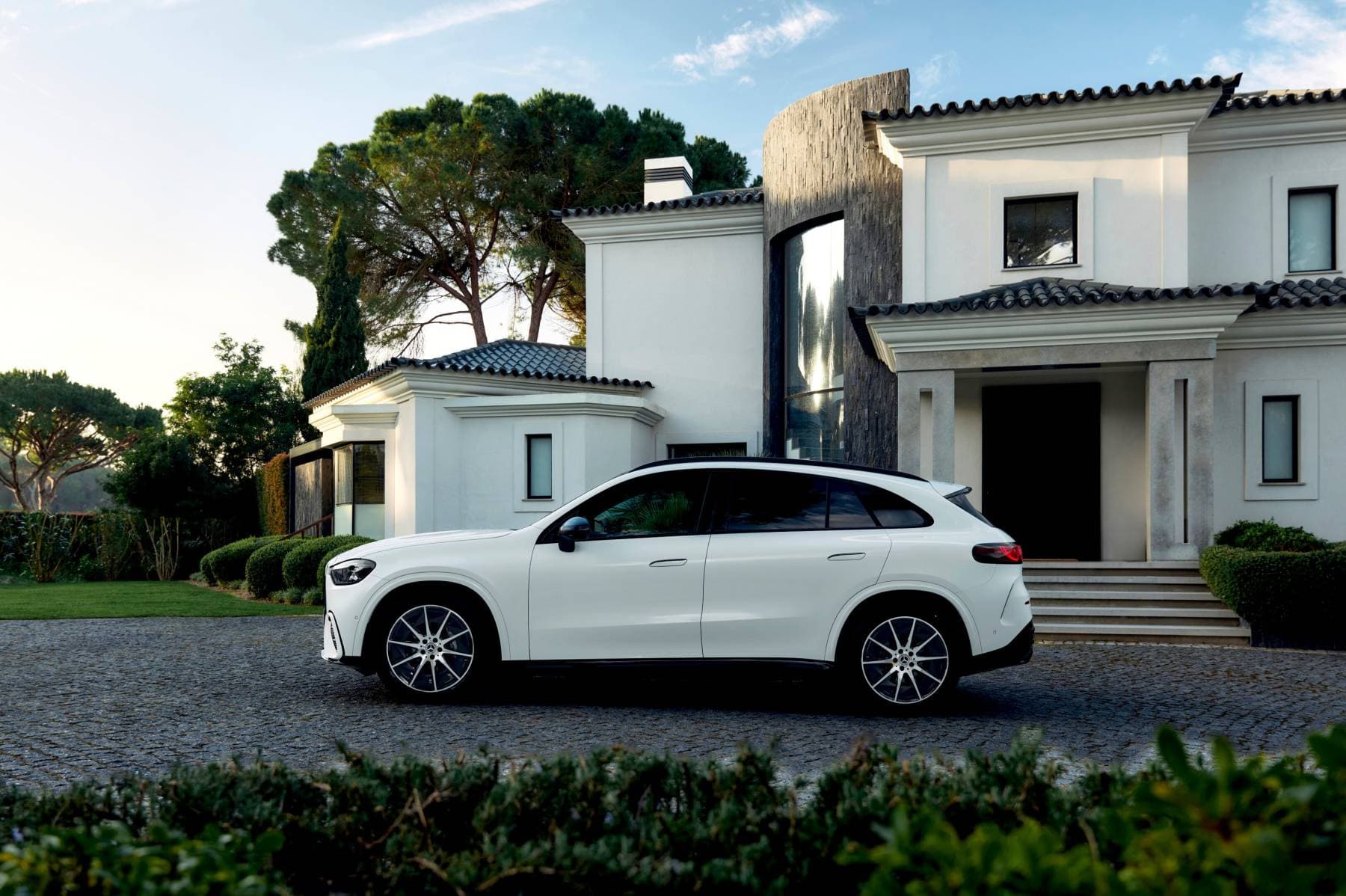 Electric Mercedes GLC parked in front of a house