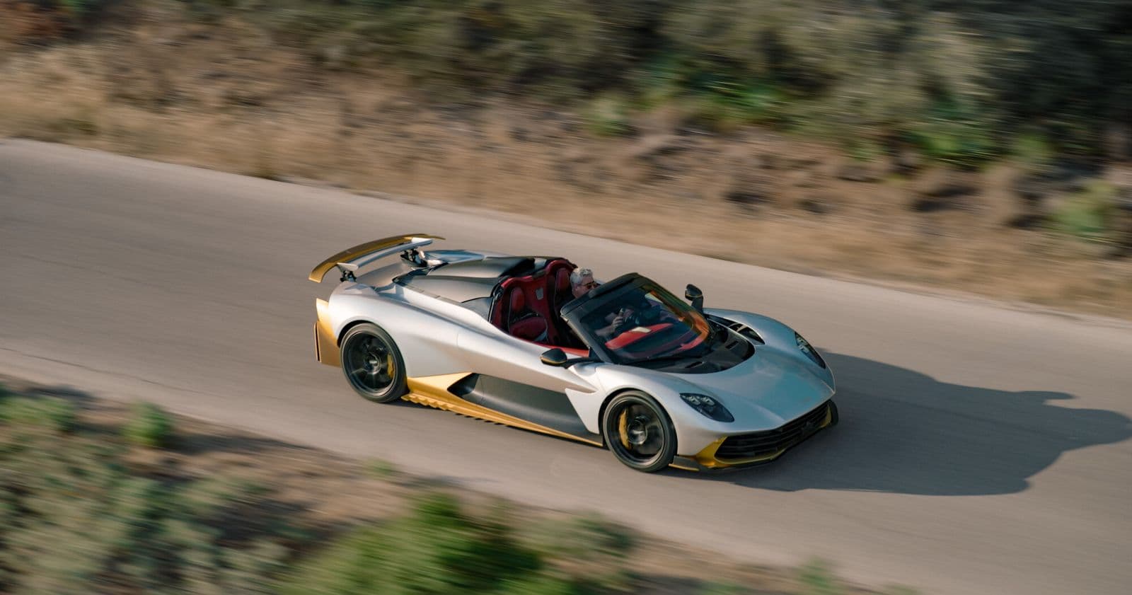 aston martin valhalla spider silver and gold roof off top view