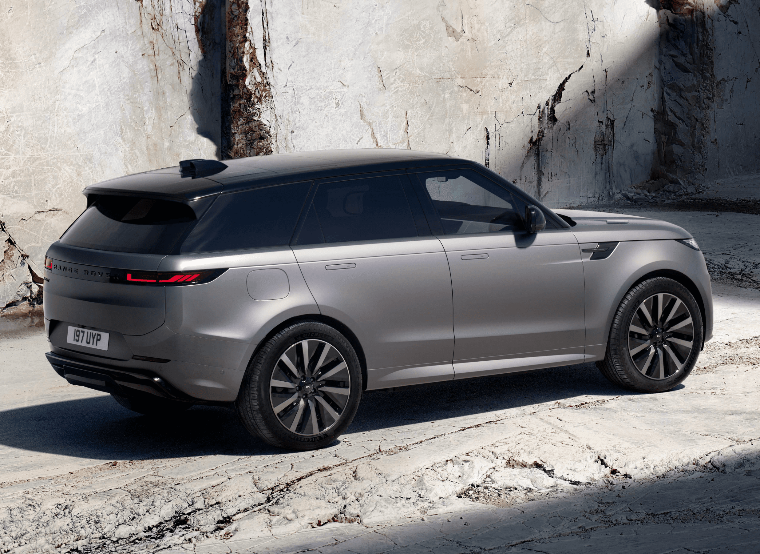 premium electric suv accelerating on mountain road