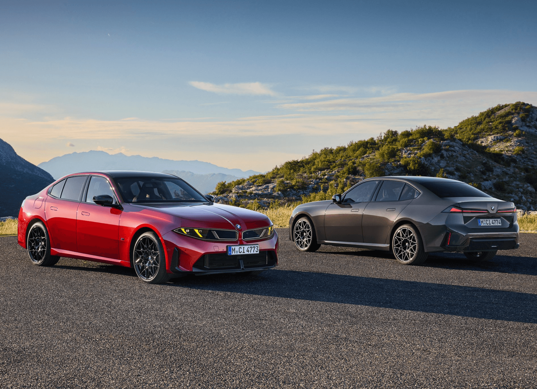 two bmw saloons combustion and electric side by side