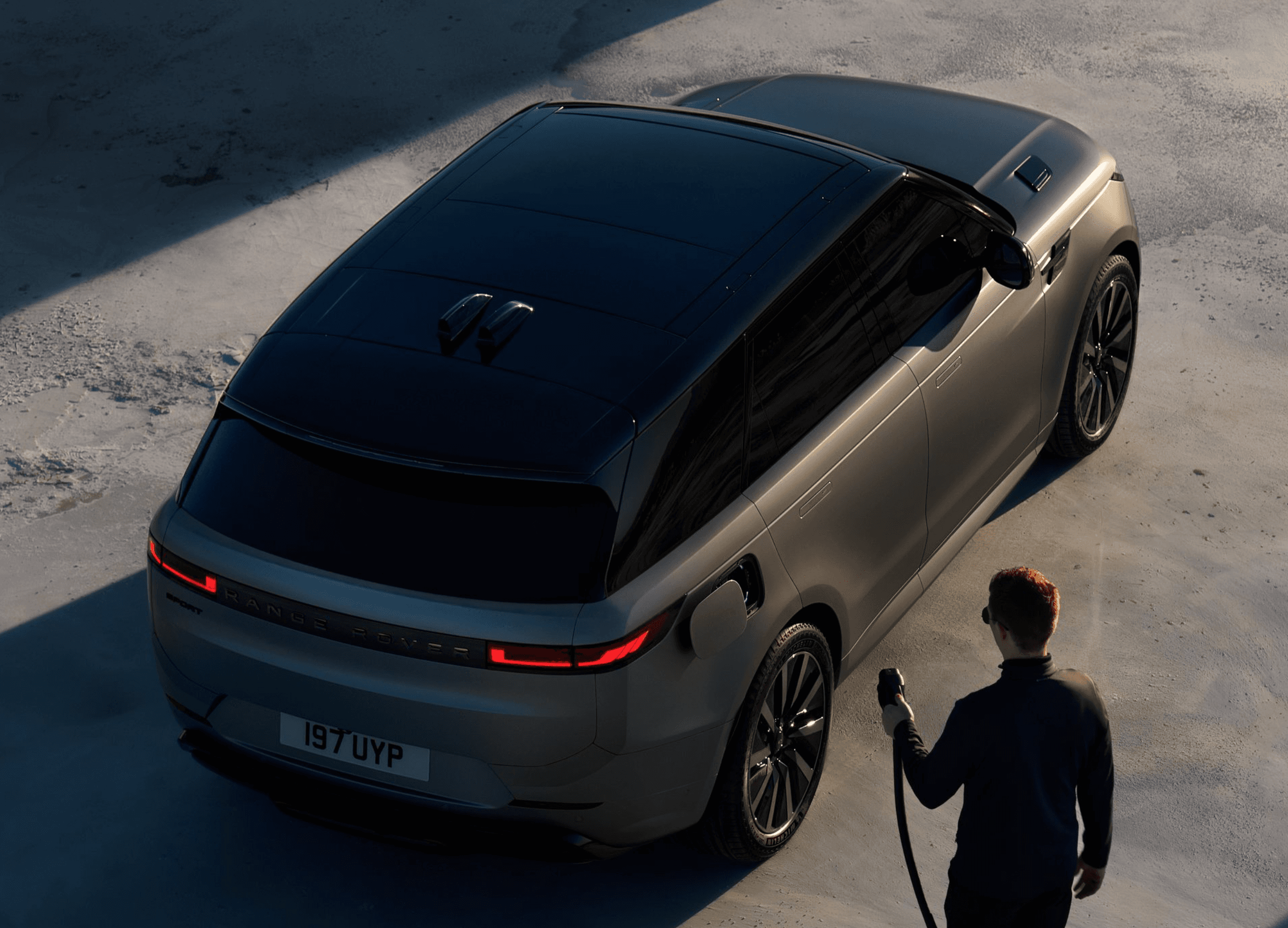 electric suv fast charging station at night